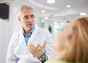 Oral surgeon explaining a procedure to patient from Mountain State Oral and Facial Surgery in Parkersburg, WV