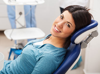 Woman in dental chair before wisdom tooth removal from Mountain State Oral and Facial Surgery in Parkersburg, WV Woman in dental chair before wisdom tooth removal from Mountain State Oral and Facial Surgery in Parkersburg, WV