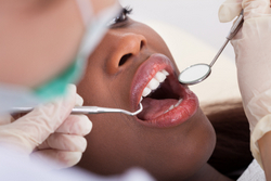 Dental patient receiving a tooth extraction at Mountain State Oral and Facial Surgery in Beckley, WV