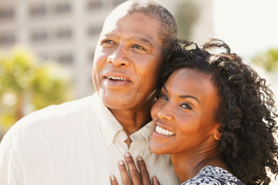 older Black couple smiling after making appointment from Mountain State Oral and Facial Surgery in Hurricane, WV