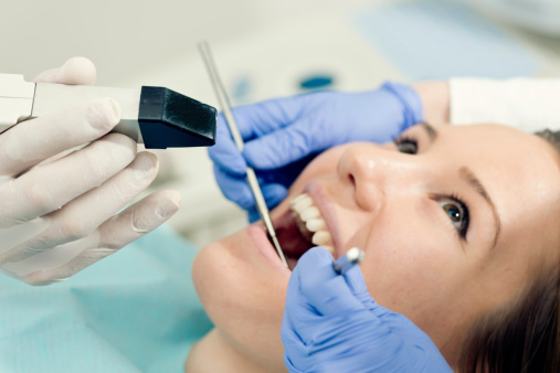 A woman's teeth being scanned by an intraoral camera at Mountain State Oral and Facial Surgery in Hurricane, WV